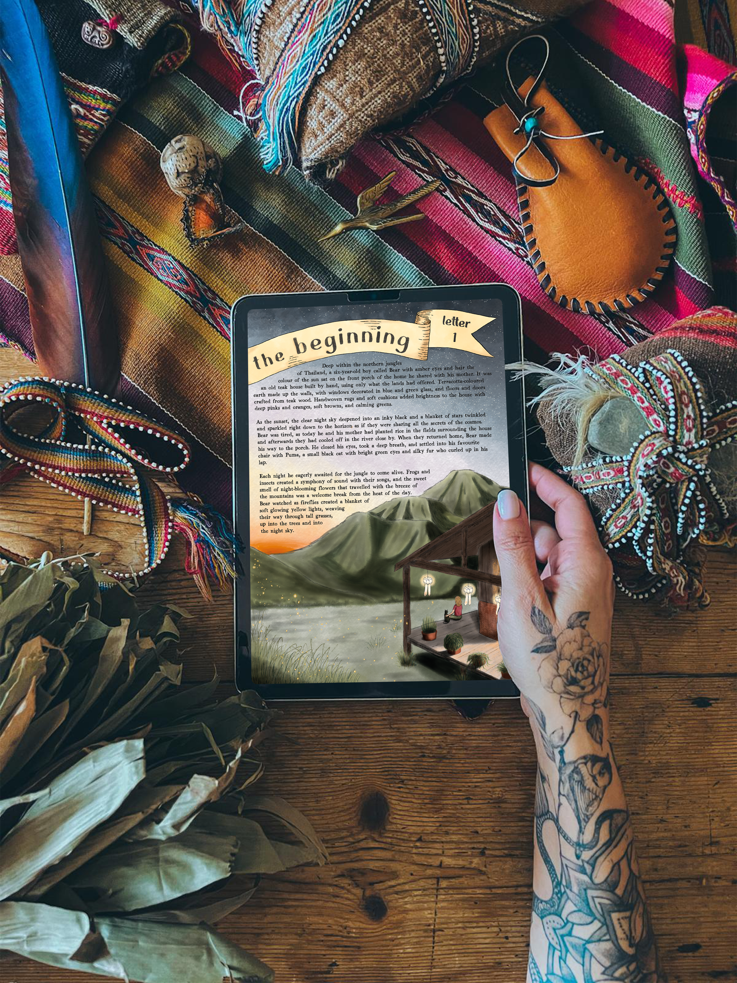 Hands holding an iPad showing an Otto & Bear story, surrounded by mesa cloths, feathers and stones