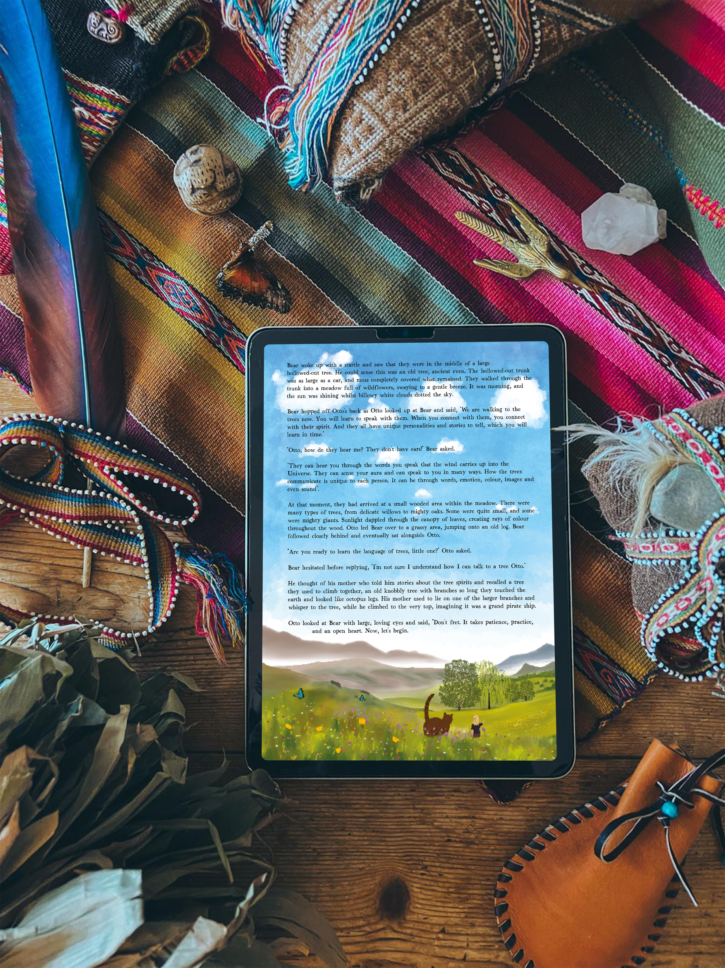 Otto & Bear story on a tablet resting among woven mesa cloths, feathers and soft light of a wooden surface with colorful fabrics and a leather pouch.